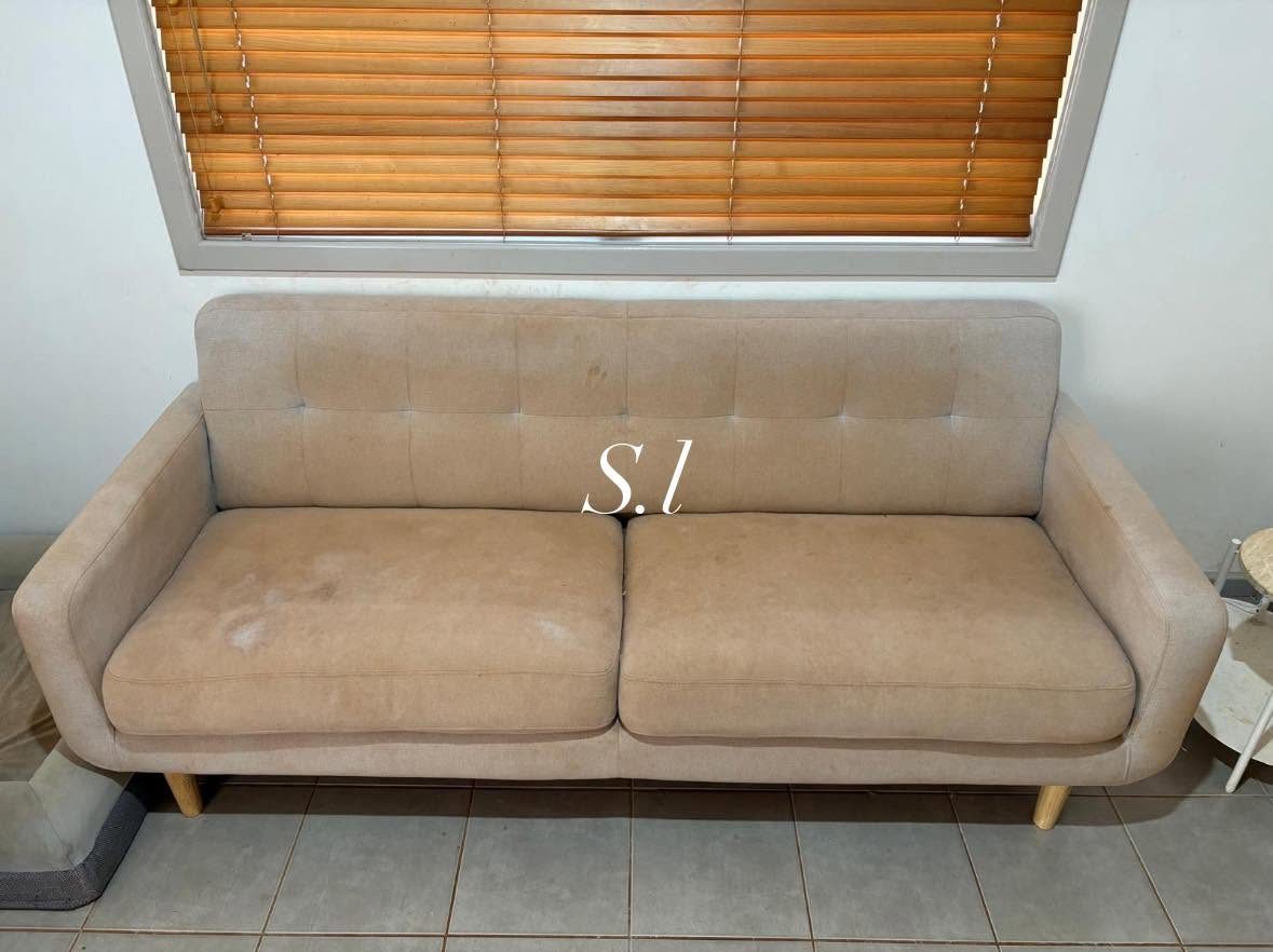 Stained fabric lounge before steam cleaning