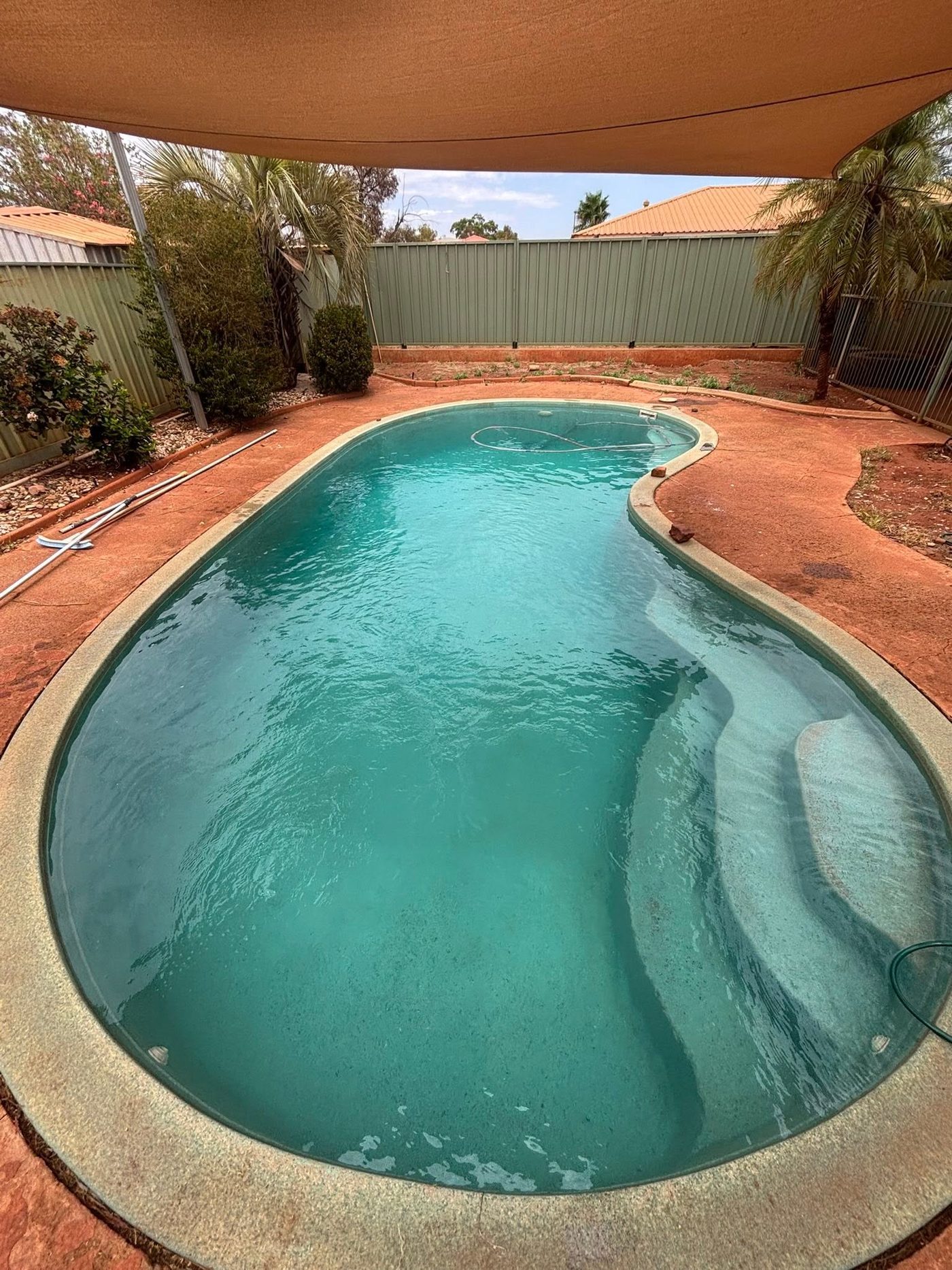 The same pool restored to clear blue water